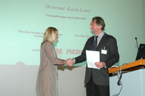 Presentation of the Egon Macher Prize to Dr. K. Loser (Münster)