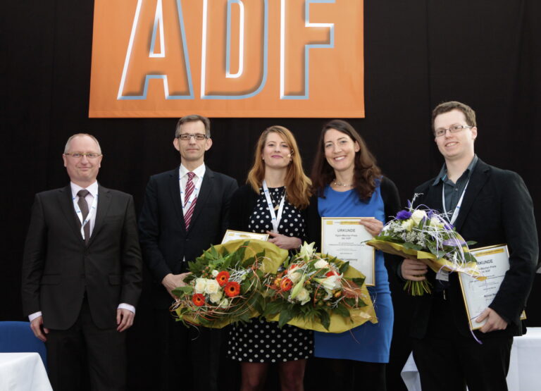 Presentation of the Egon Macher Award to J. Landsberg (center), J. Kohlmeyer (second from right), and M. Renn (right) by J. Frank (left) and K. Schäkel (second from left)