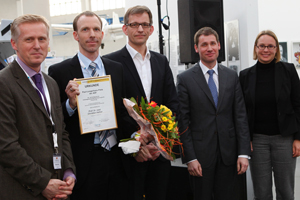 -Presentation of the Paul Langerhans Award to C. Hafner by Board of Trustees members M. Hertl and K. Schäkel and a representative of the sponsor, Biogen-Idec GmbH