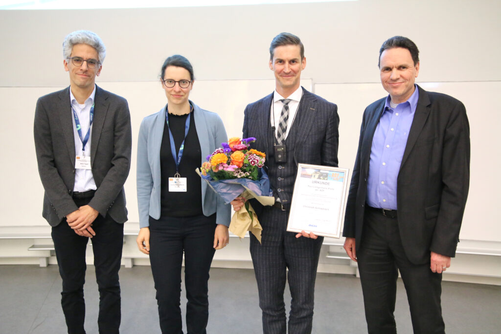 Presentation of the Paul Langerhans Award to Christoph Schlapbach (Bern), second from the right, with Amir Yazdi (Award Board), left, Luise Erpenbeck (ADF Board Member), second from the left, and Marcus Schulte (sponsor Amgen GmbH), right.