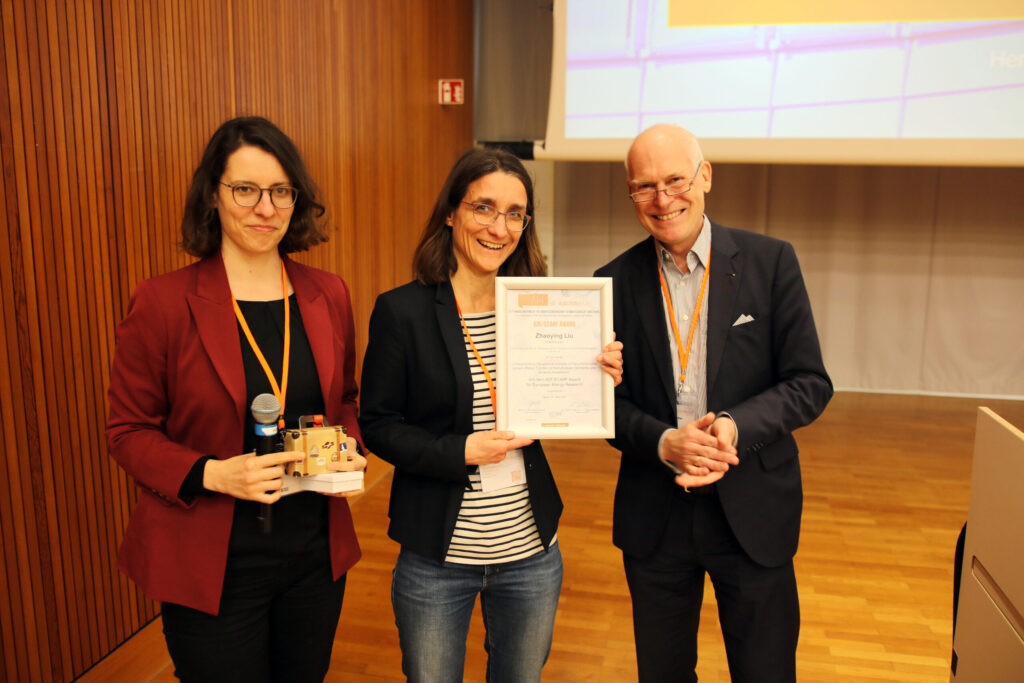 resentation of the ADF-ECARF Award to Zhaoying Liu (m: accepting on her behalf); left: L. Erpenbeck (ADF Board Member), right: T. Zuberbier (ECARF Award Board of Trustees)